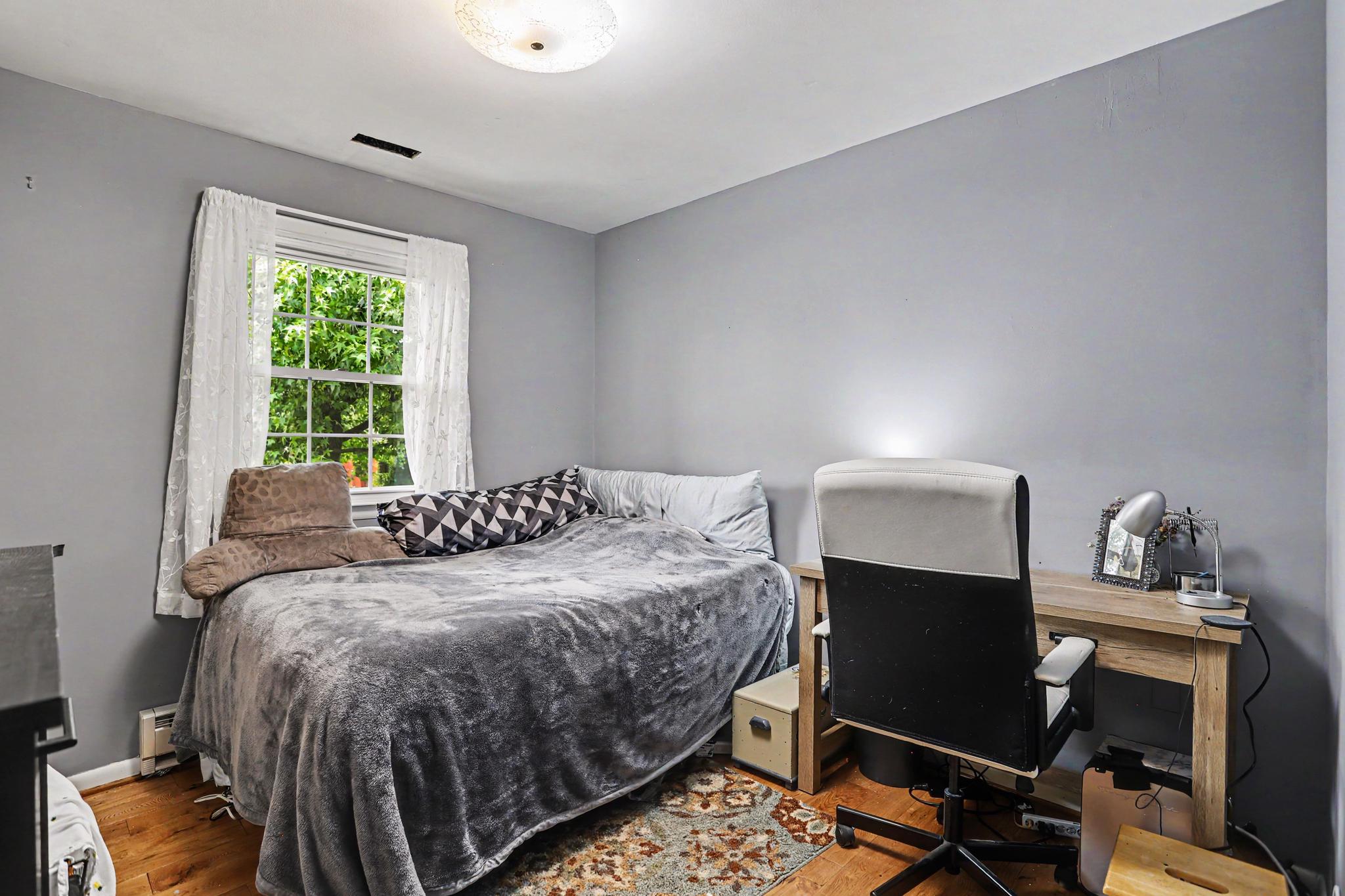 2226 Harney Road Littlestown, PA 17340 - Photo 21 of 40 a bedroom with a bed chair and a window