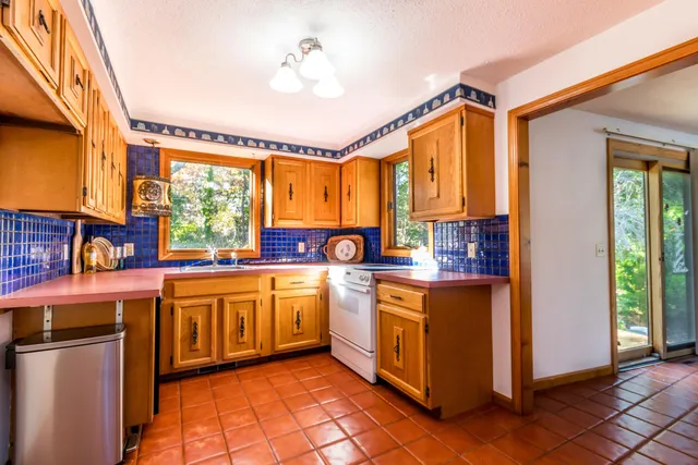 a view of living room filled with furniture and wooden floor