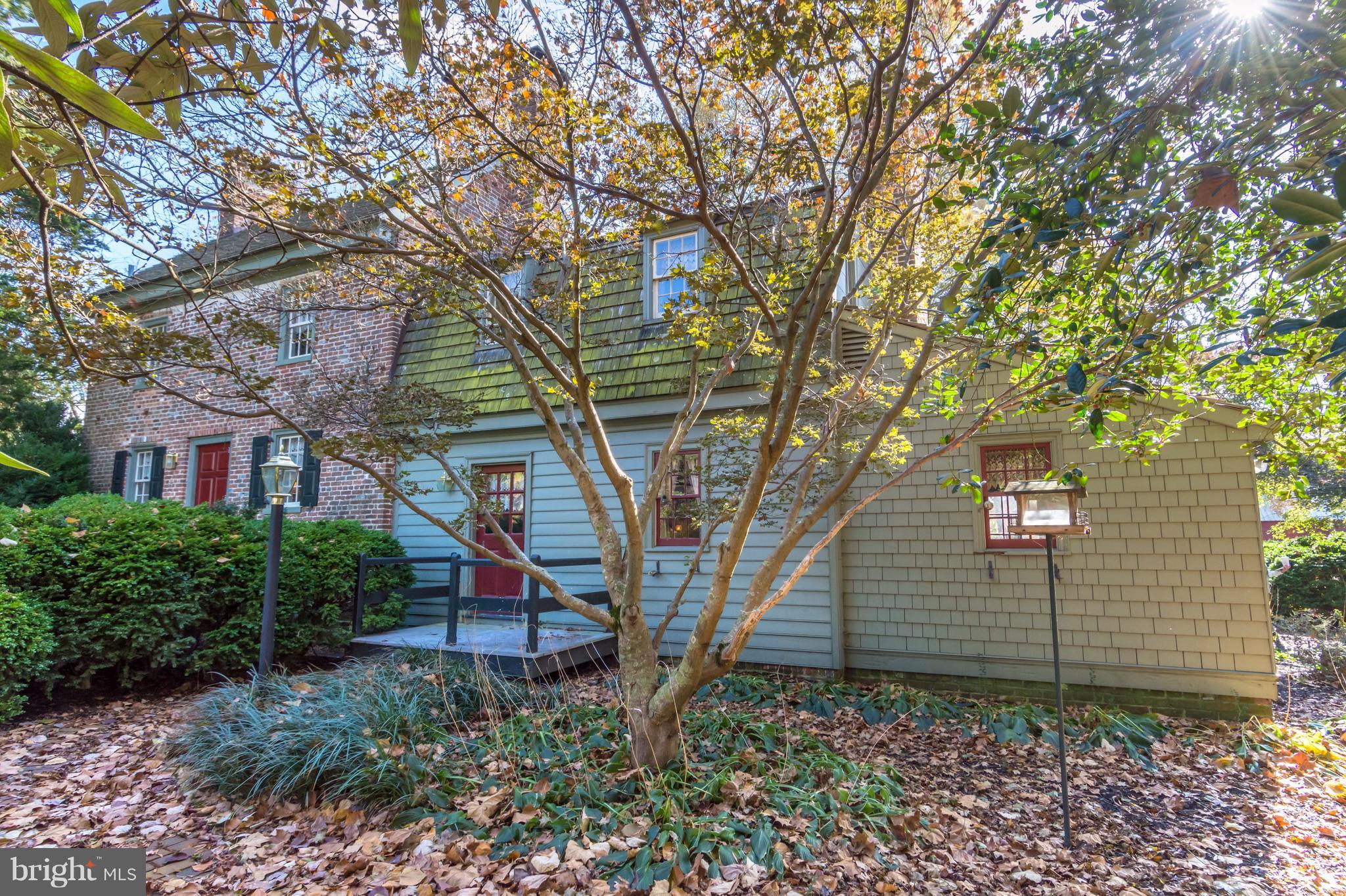 a front view of a house with lots of garden