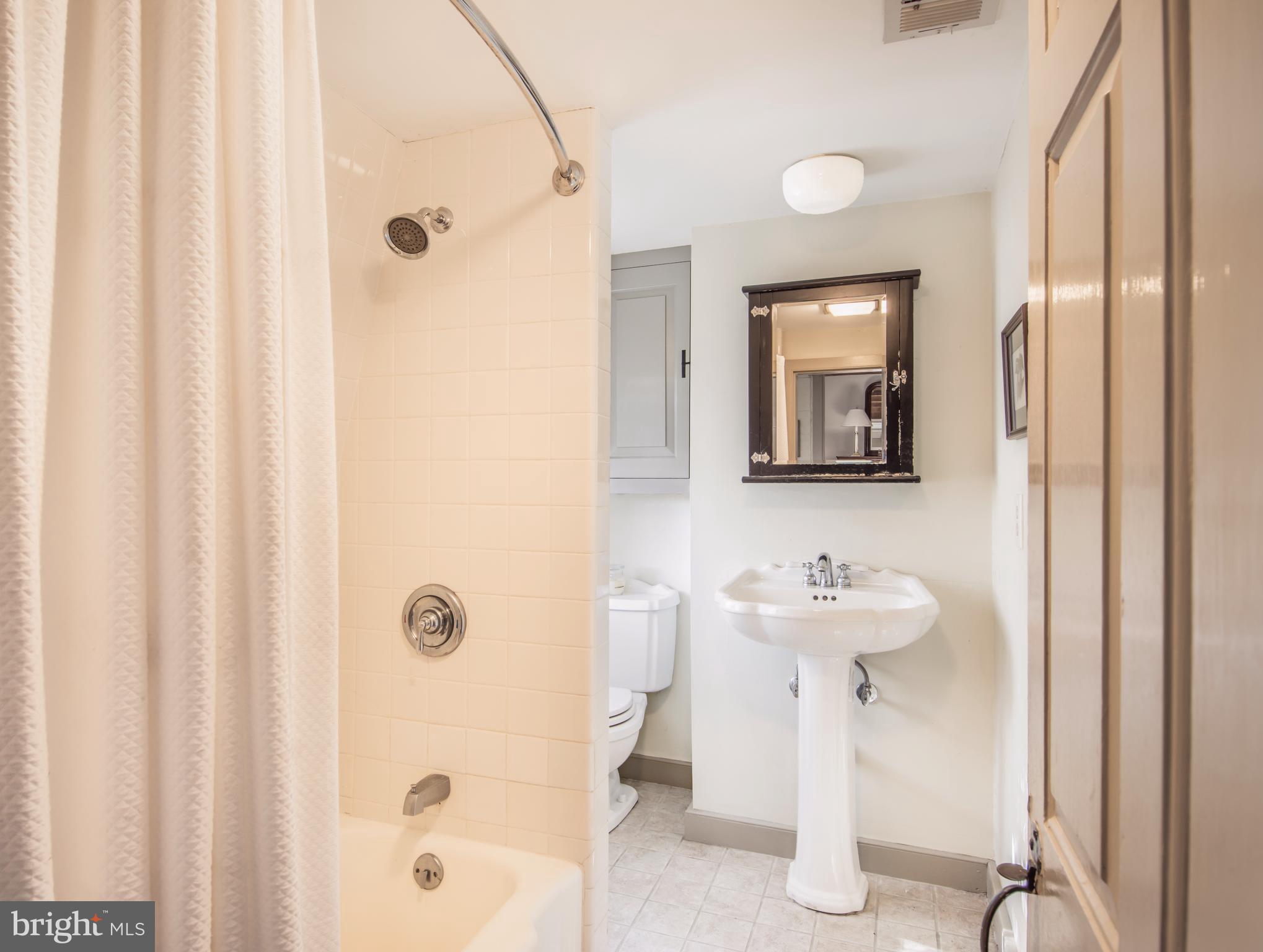1625 Peters Corner Road Marydel, MD 21649 - Photo 17 of 30 a bathroom with a sink toilet and shower