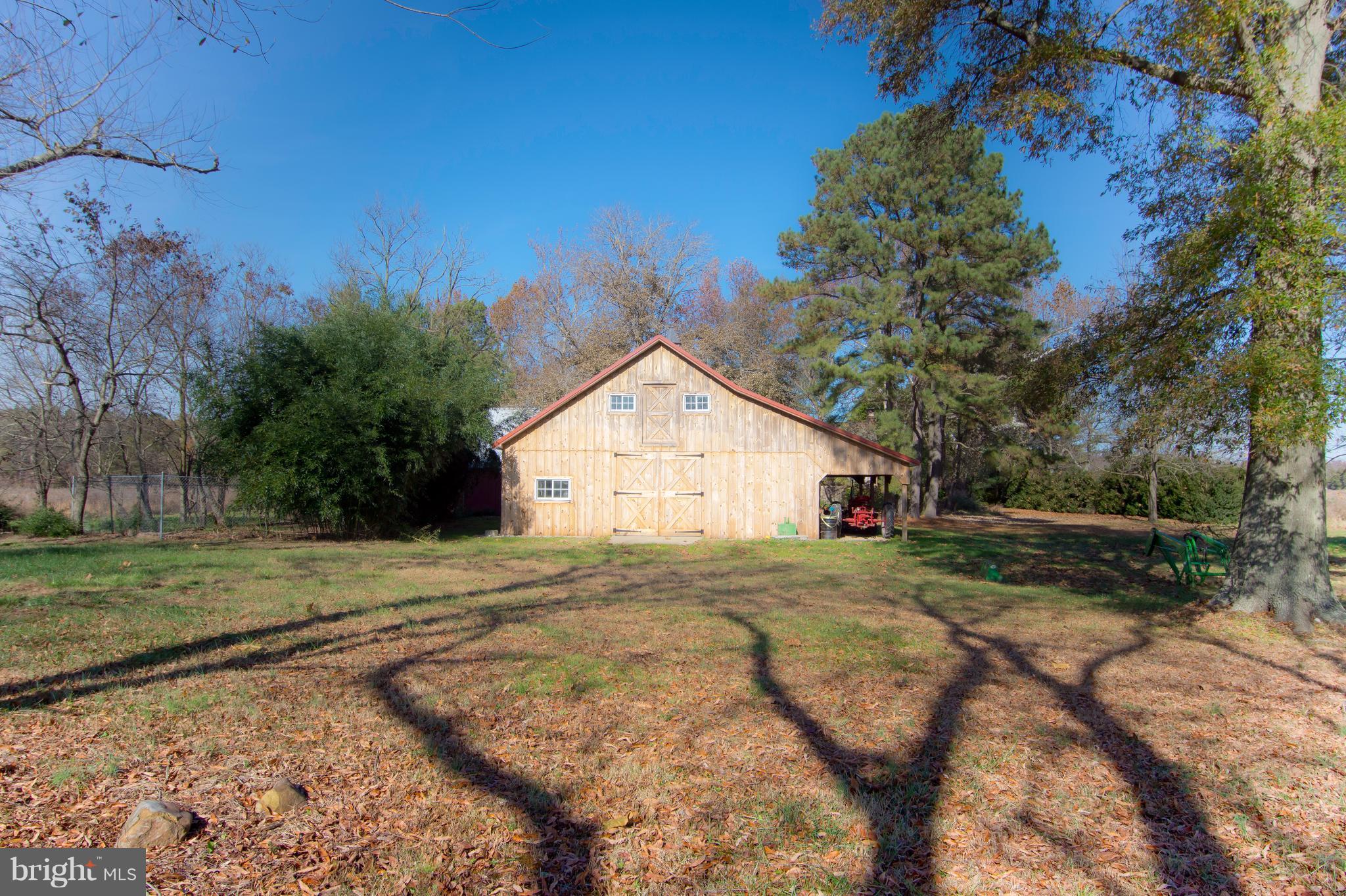 1625 Peters Corner Road Marydel, MD 21649 - Photo 25 of 30 a view of a wooden house with a yard