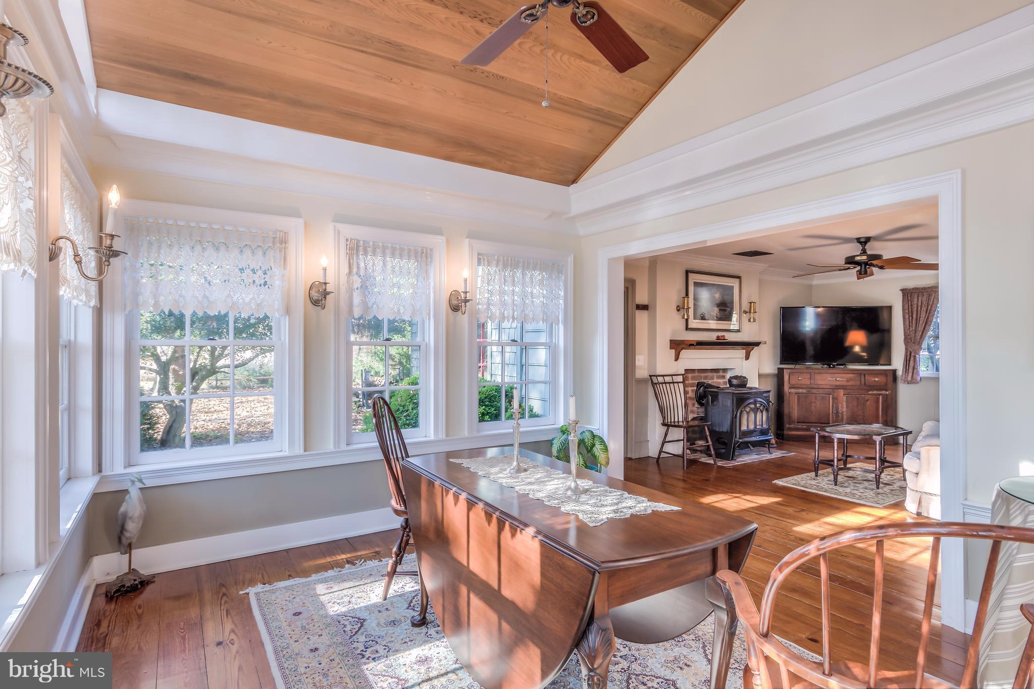 1625 Peters Corner Road Marydel, MD 21649 - Photo 8 of 30 a dining room with furniture and large windows