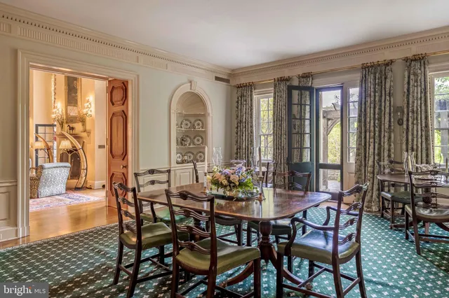 a living room with furniture a lamp and a fireplace