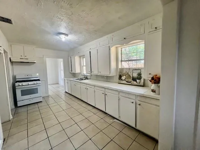 a view of an empty room and closet area