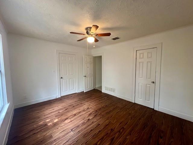 308 North Retta Street Fort Worth, TX 76111 - Photo 18 of 24 a view of empty room with wooden floor and fan