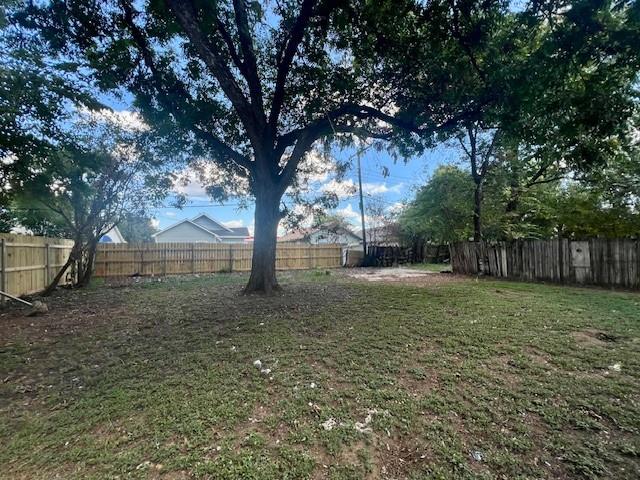 308 North Retta Street Fort Worth, TX 76111 - Photo 23 of 24 a view of a tree in the middle of a yard