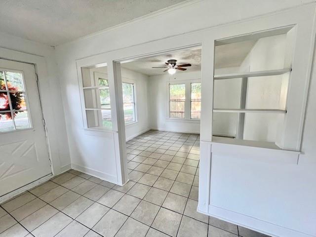 308 North Retta Street Fort Worth, TX 76111 - Photo 6 of 24 a view of a hallway with bathroom and a glass door