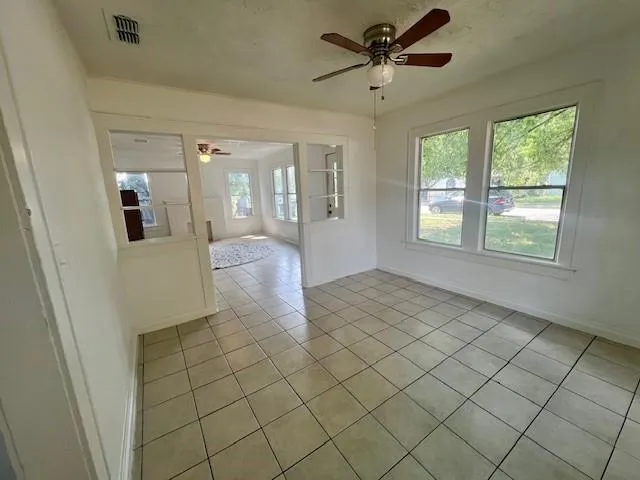 a view of an empty room and window