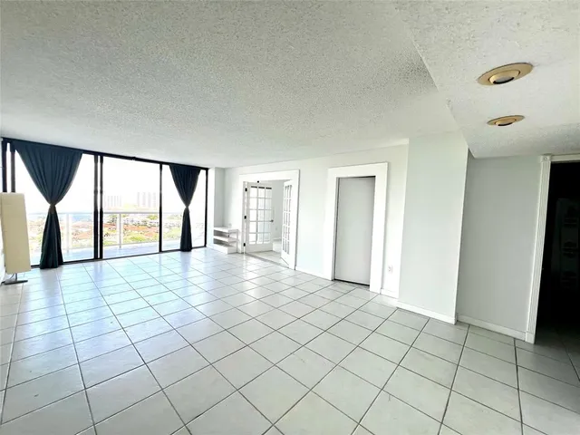 a view of an empty room and window