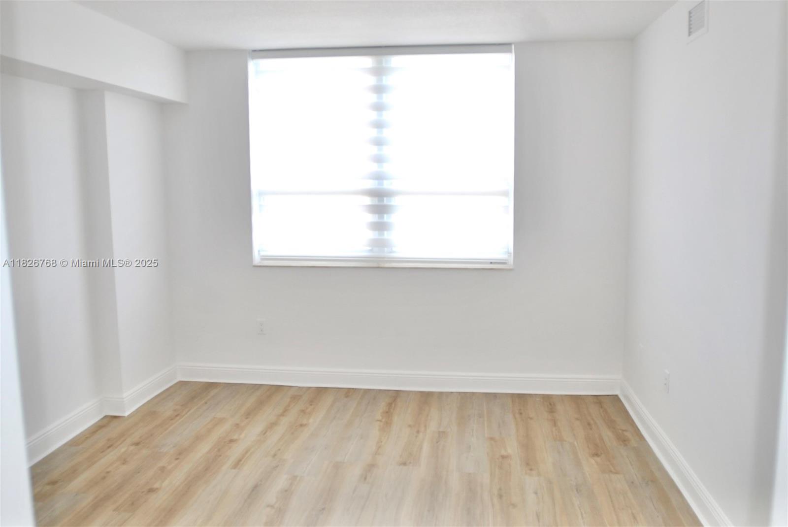 3232 Southwest 22nd Terrace, Unit 1008 Miami, FL 33145 - Photo 11 of 19 a view of a room that has a window in it