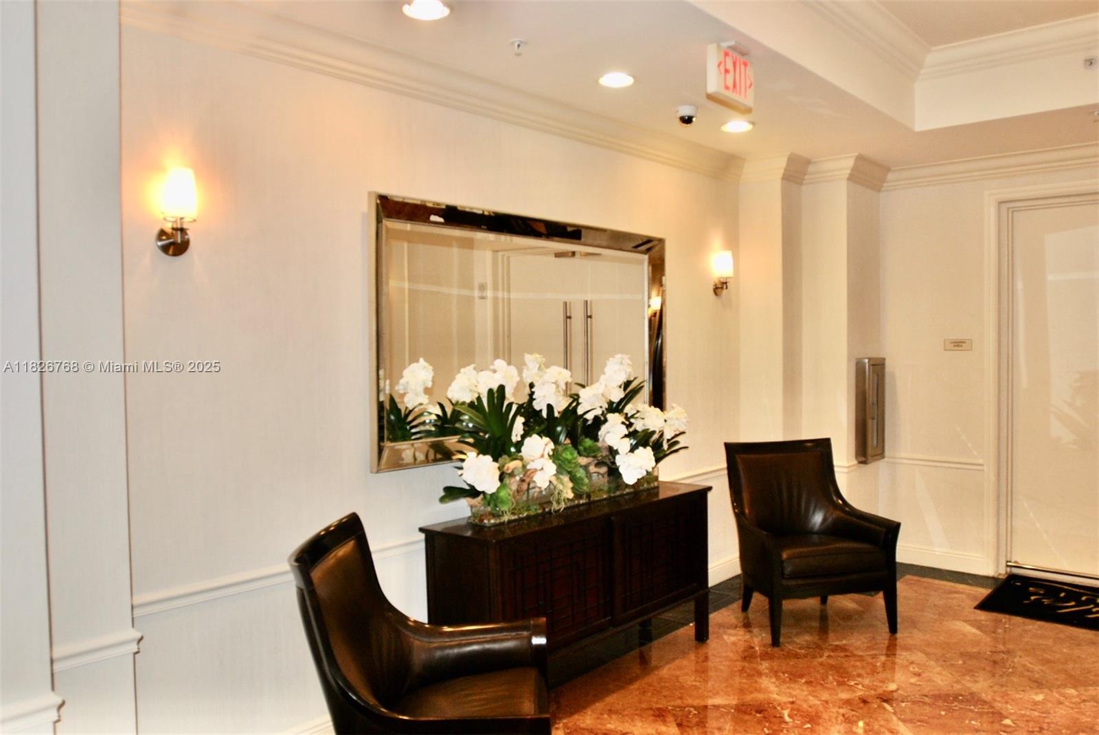 3232 Southwest 22nd Terrace, Unit 1008 Miami, FL 33145 - Photo 18 of 19 a living room with furniture and a chandelier