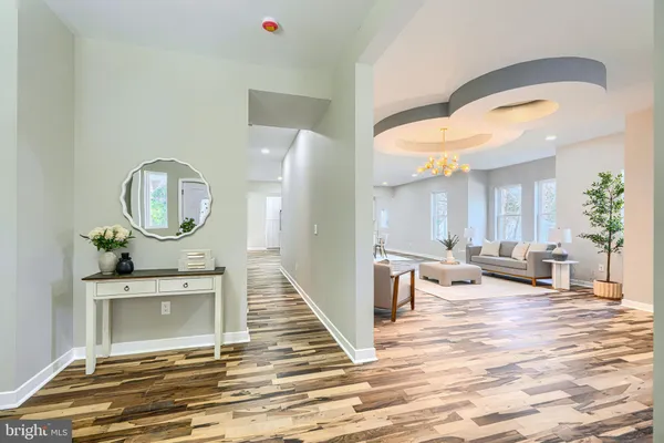 a white bath tub sitting next to a white toilet