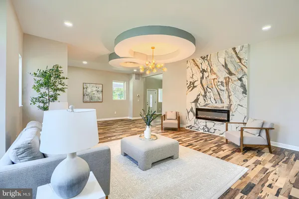 a bathroom with a bathtub shower sink vanity and toilet
