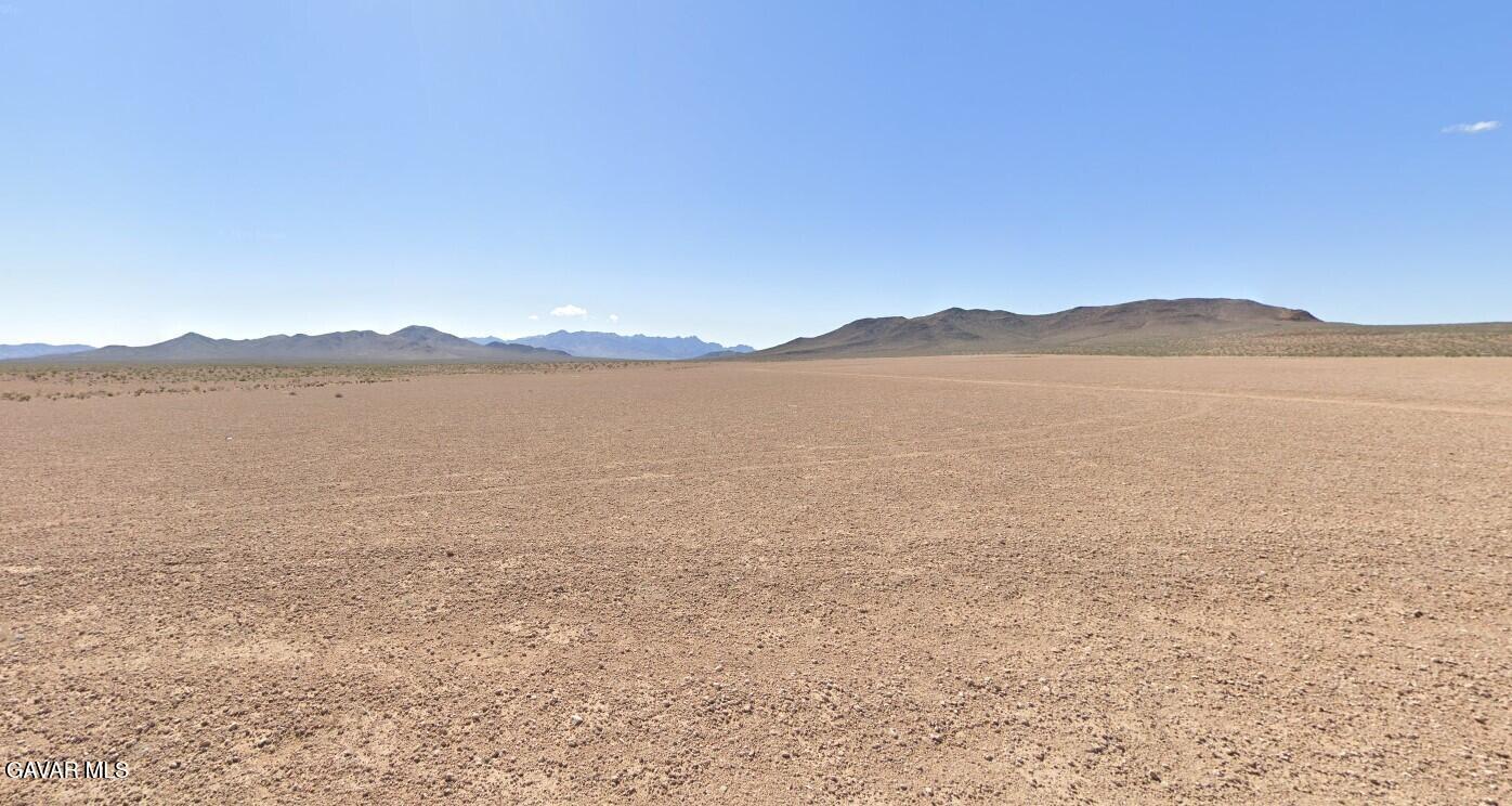 Charity Lane Tecopa, CA 92389 - Photo 2 of 11 a view of an lake with a mountain in the background