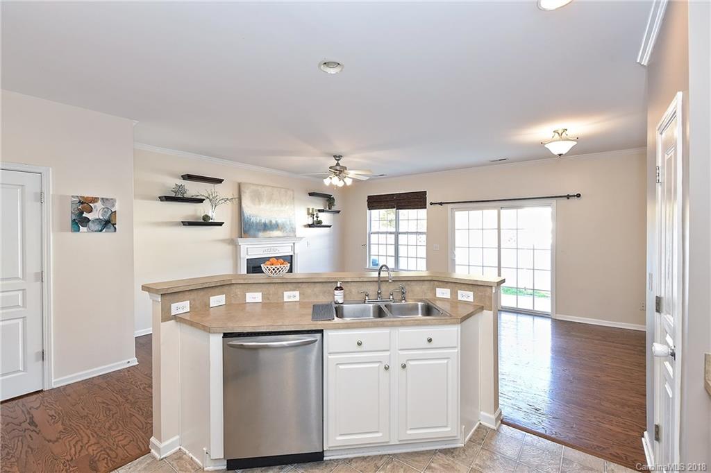 642 Brickdust Court Fort Mill, SC 29708 - Photo 12 of 24 a kitchen with granite countertop a sink and cabinets