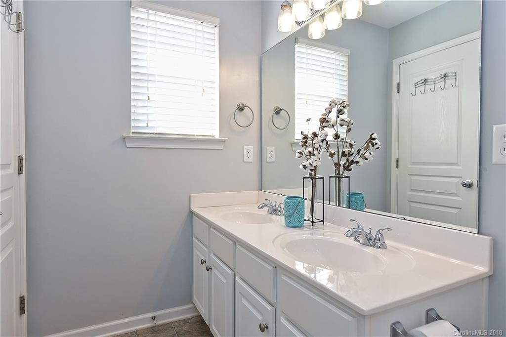 642 Brickdust Court Fort Mill, SC 29708 - Photo 17 of 24 a bathroom with a sink and a mirror