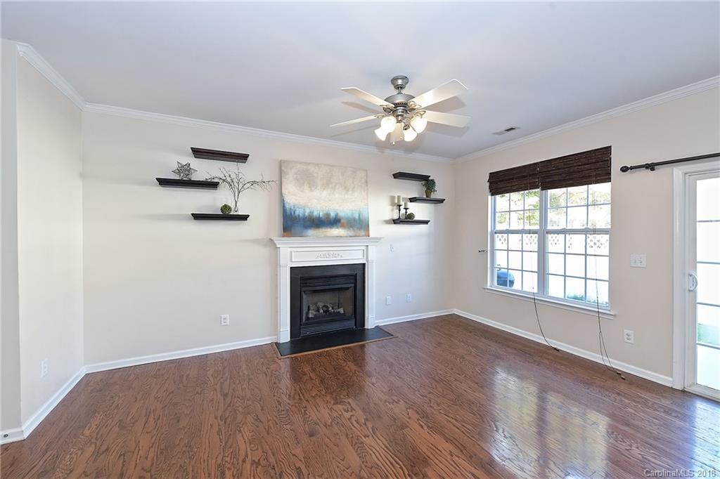 642 Brickdust Court Fort Mill, SC 29708 - Photo 5 of 24 a view of empty room with a fireplace and wooden floor