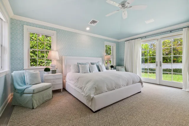 a spacious bedroom with a bed and a couch