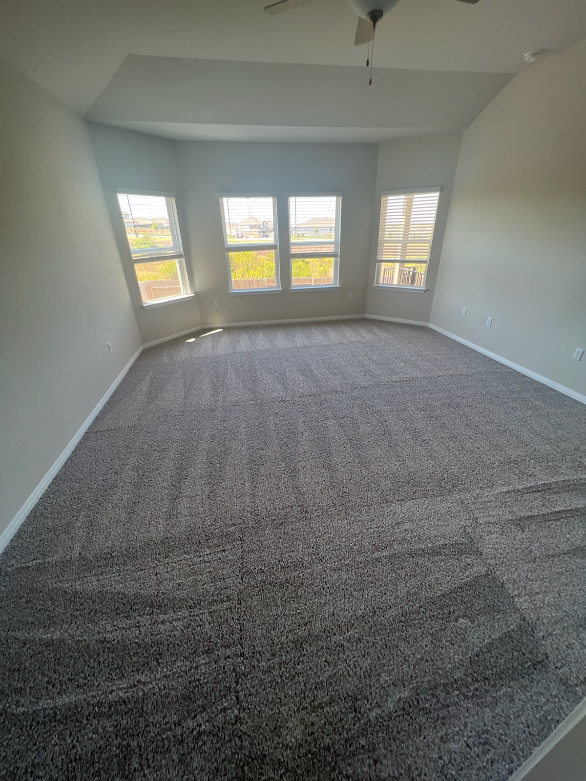 6400 Rounded Pebble Lane Buda, TX 78610 - Photo 14 of 34 en empty room with windows