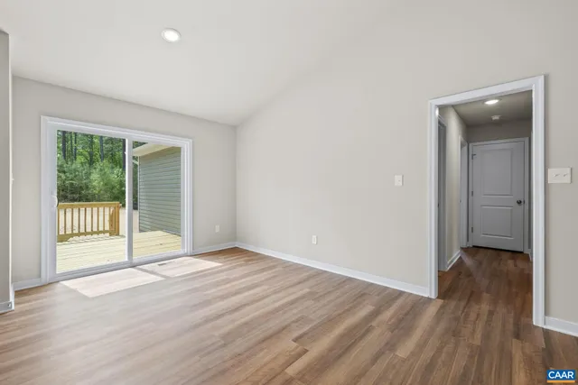 a kitchen with stainless steel appliances granite countertop a sink stove microwave and refrigerator