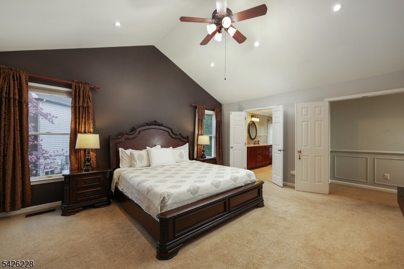 5 Gordon Place Bernards, NJ 07920 - Photo 13 of 30 a bedroom with a large bed and a large window