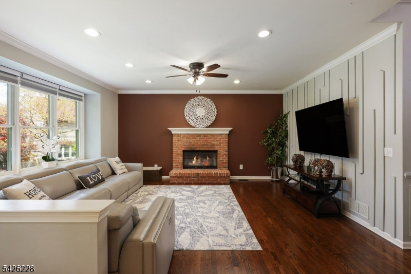5 Gordon Place Bernards, NJ 07920 - Photo 5 of 30 a living room with furniture fireplace and flat screen tv