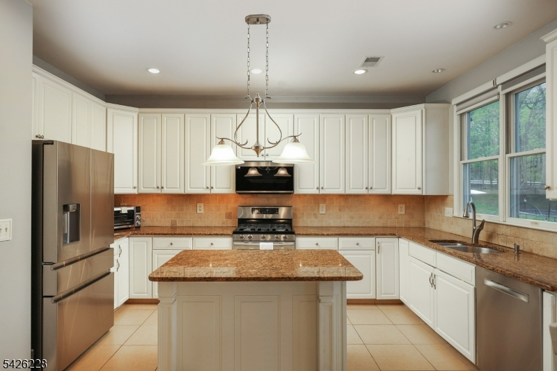 5 Gordon Place Bernards, NJ 07920 - Photo 10 of 30 a kitchen with a sink stainless steel appliances and cabinets