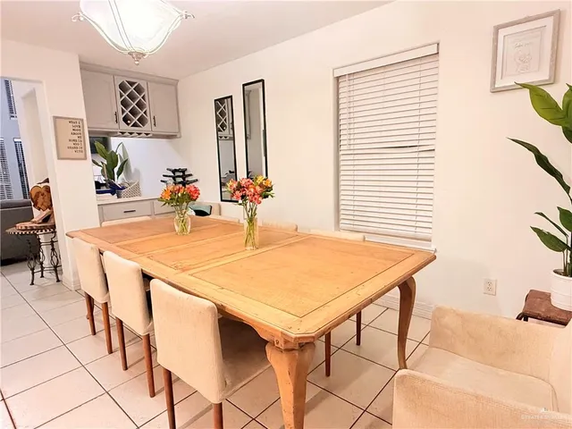 a dining room with a table and chairs in it