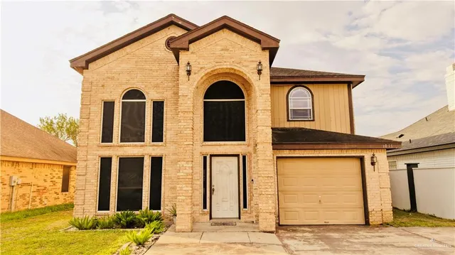 a front view of a house with yard