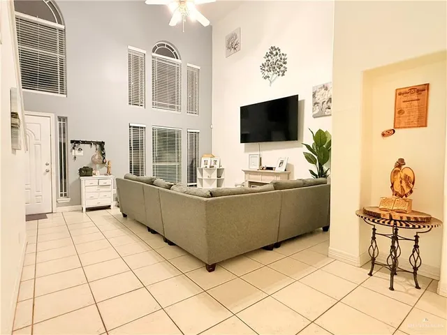 a living room with furniture and flat screen tv