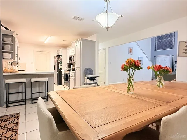 a room with stainless steel appliances kitchen island granite countertop furniture and a kitchen view