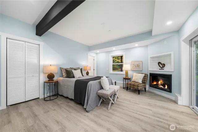 a bed room with furniture and a fireplace