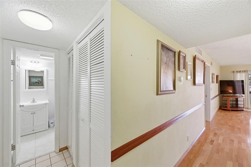 11485 Oakhurst Road, Unit 200208 Largo, FL 33774 - Photo 16 of 25 a view of a hallway with closet and bathroom