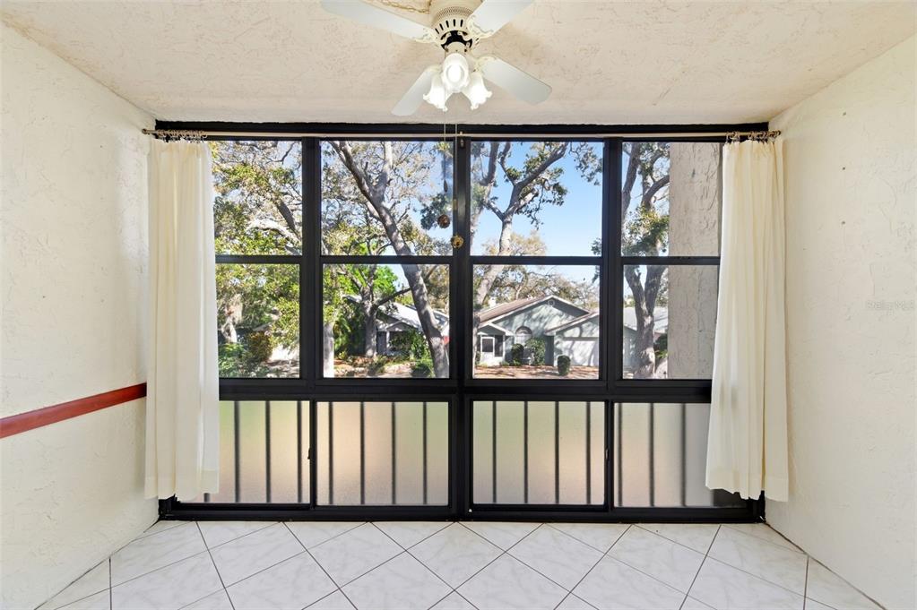 11485 Oakhurst Road, Unit 200208 Largo, FL 33774 - Photo 10 of 25 a view of a large window with an outdoor space