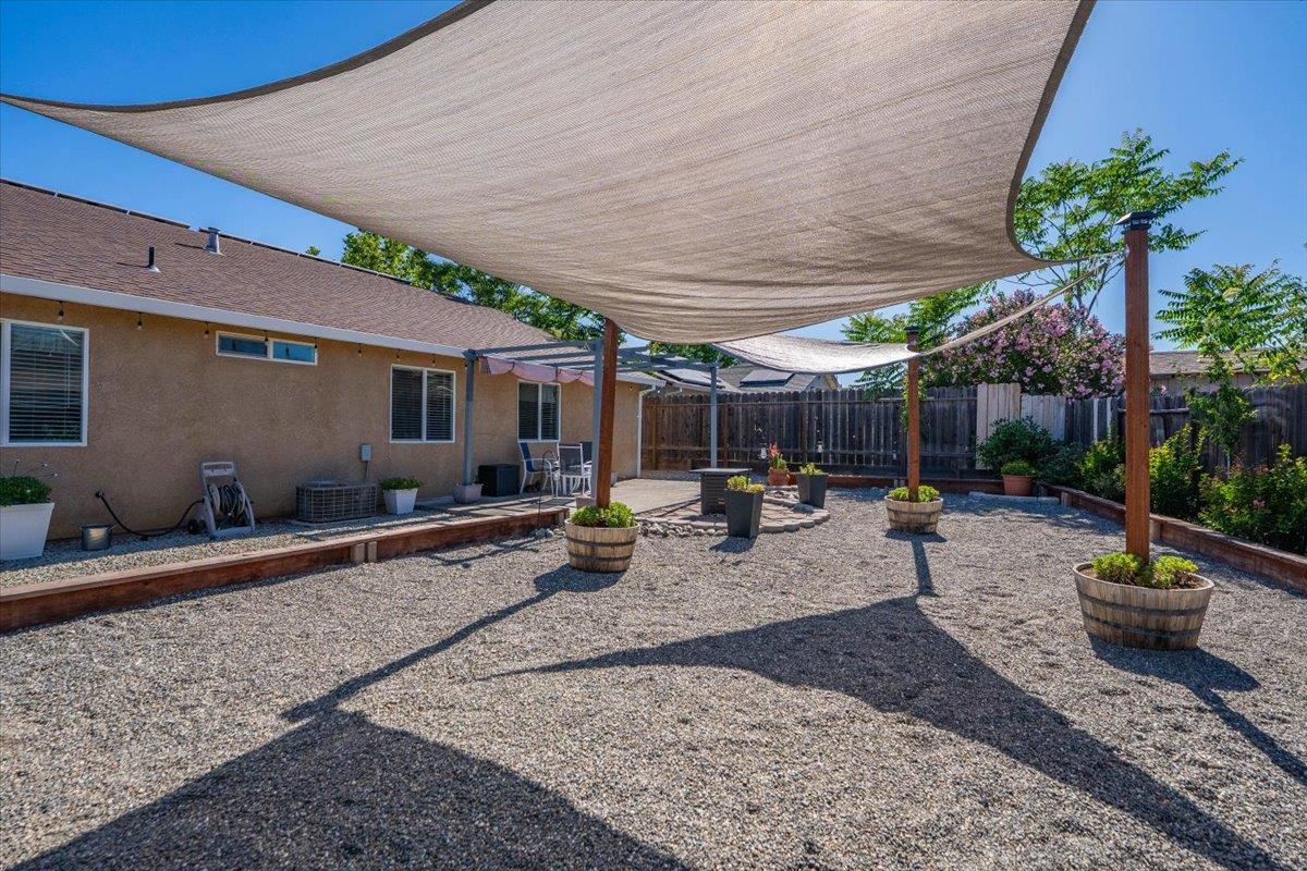 2110 Gentry Way Red Bluff, CA 96080 - Photo 41 of 47 a view of a backyard with plants and chairs