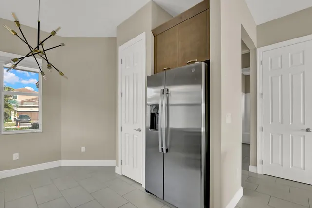 a view of a bathroom with a shower and a mirror