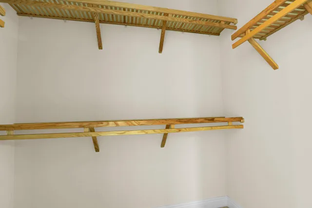 a view of a room with racks on the wall