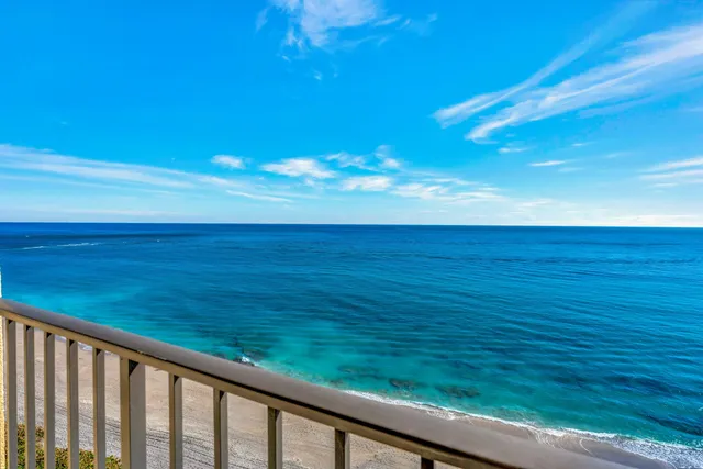 a view of a balcony with an ocean view