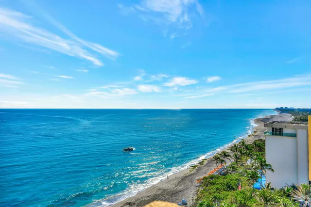 a view of a hallway with furniture and entryway