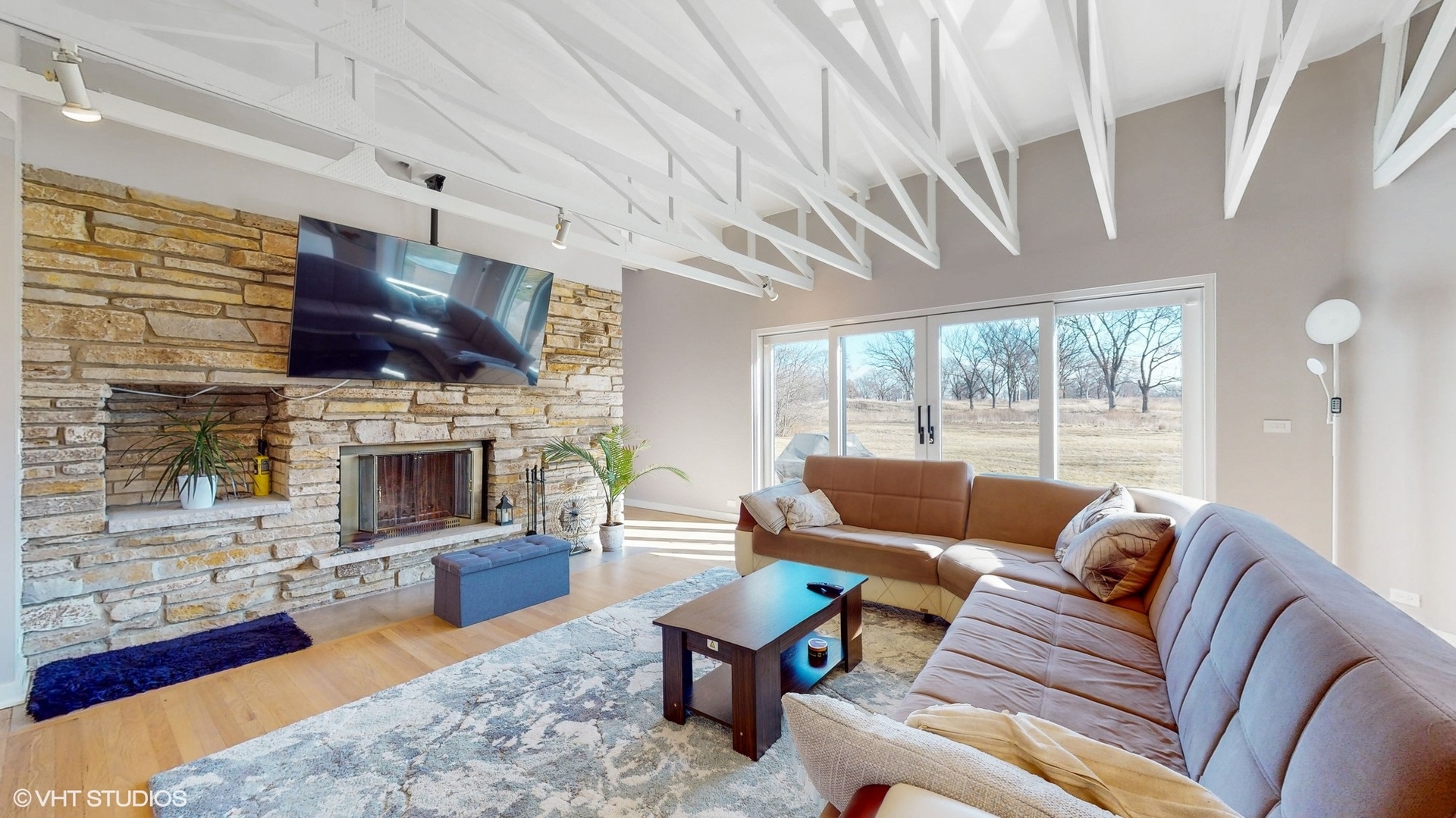 711 Lee Road Northbrook, IL 60062 - Photo 12 of 30 a living room with furniture a fireplace and a flat screen tv