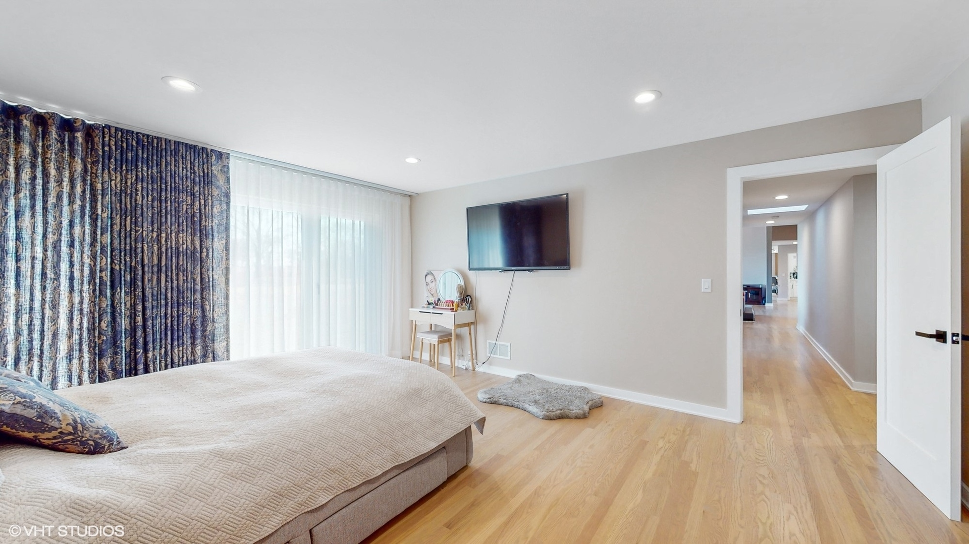 711 Lee Road Northbrook, IL 60062 - Photo 13 of 30 a bedroom with a bed and a wooden floor