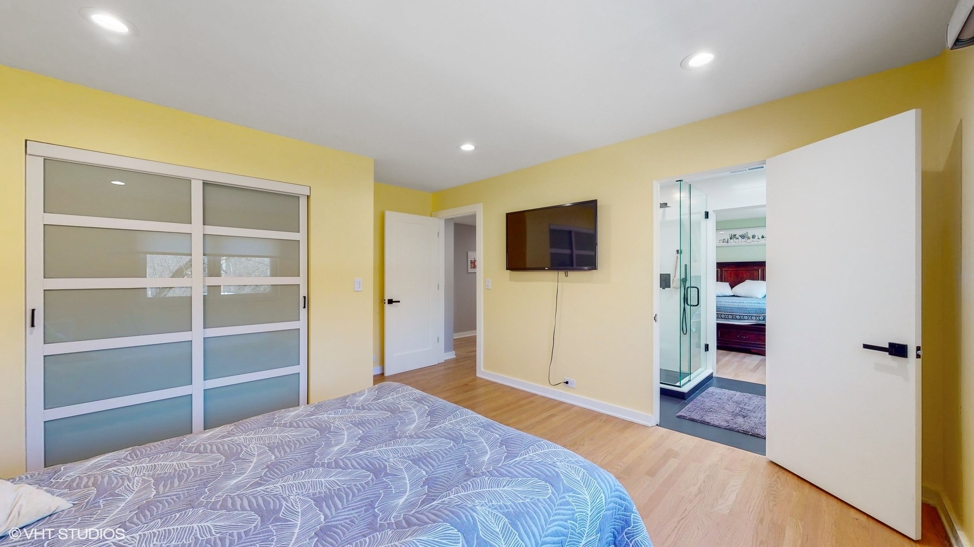 711 Lee Road Northbrook, IL 60062 - Photo 17 of 30 a bedroom with a bed and a flat screen tv