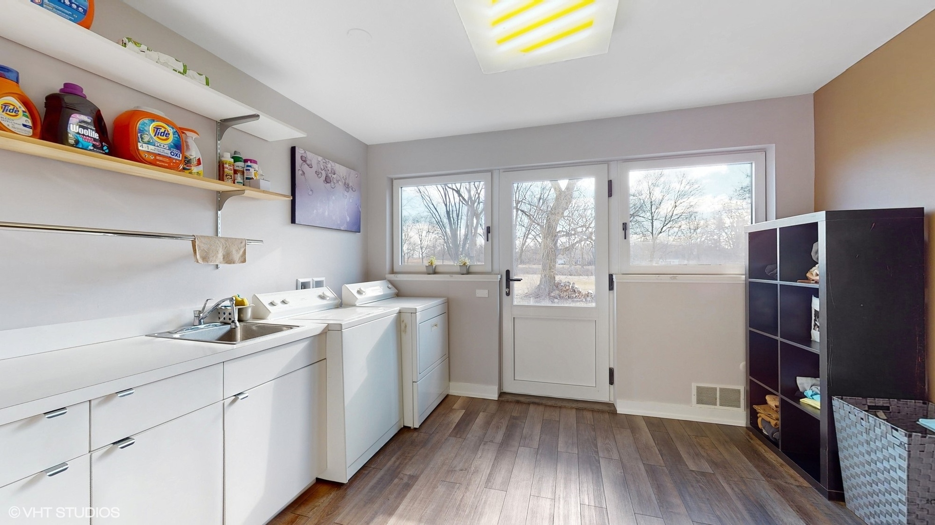 711 Lee Road Northbrook, IL 60062 - Photo 23 of 30 a kitchen with a sink and wooden floor