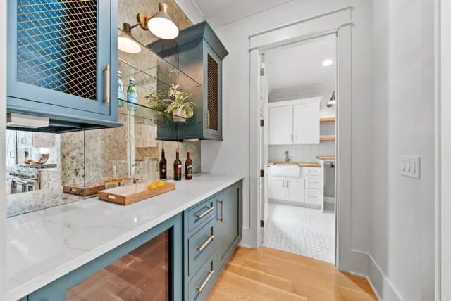 a kitchen with a sink appliances and cabinets