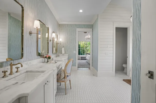 a spacious bathroom with a double vanity sink and a mirror