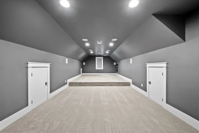 a view of a big room with closet and chandelier fan