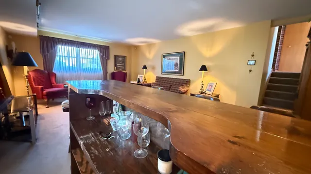 a living room with fireplace furniture and a window