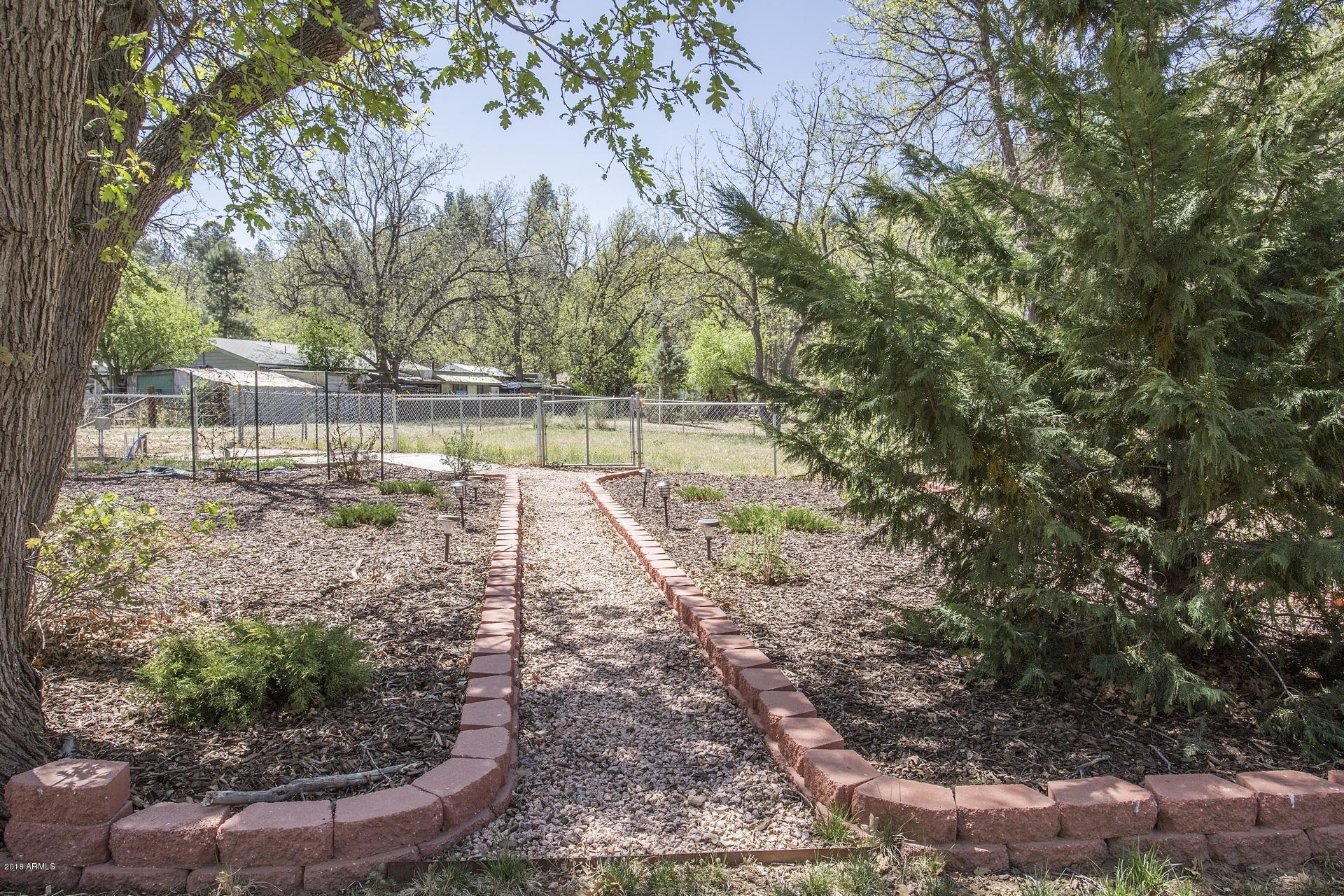 9247 Juniper Road Strawberry, AZ 85544 - Photo 42 of 54 Walkway to Backyard
