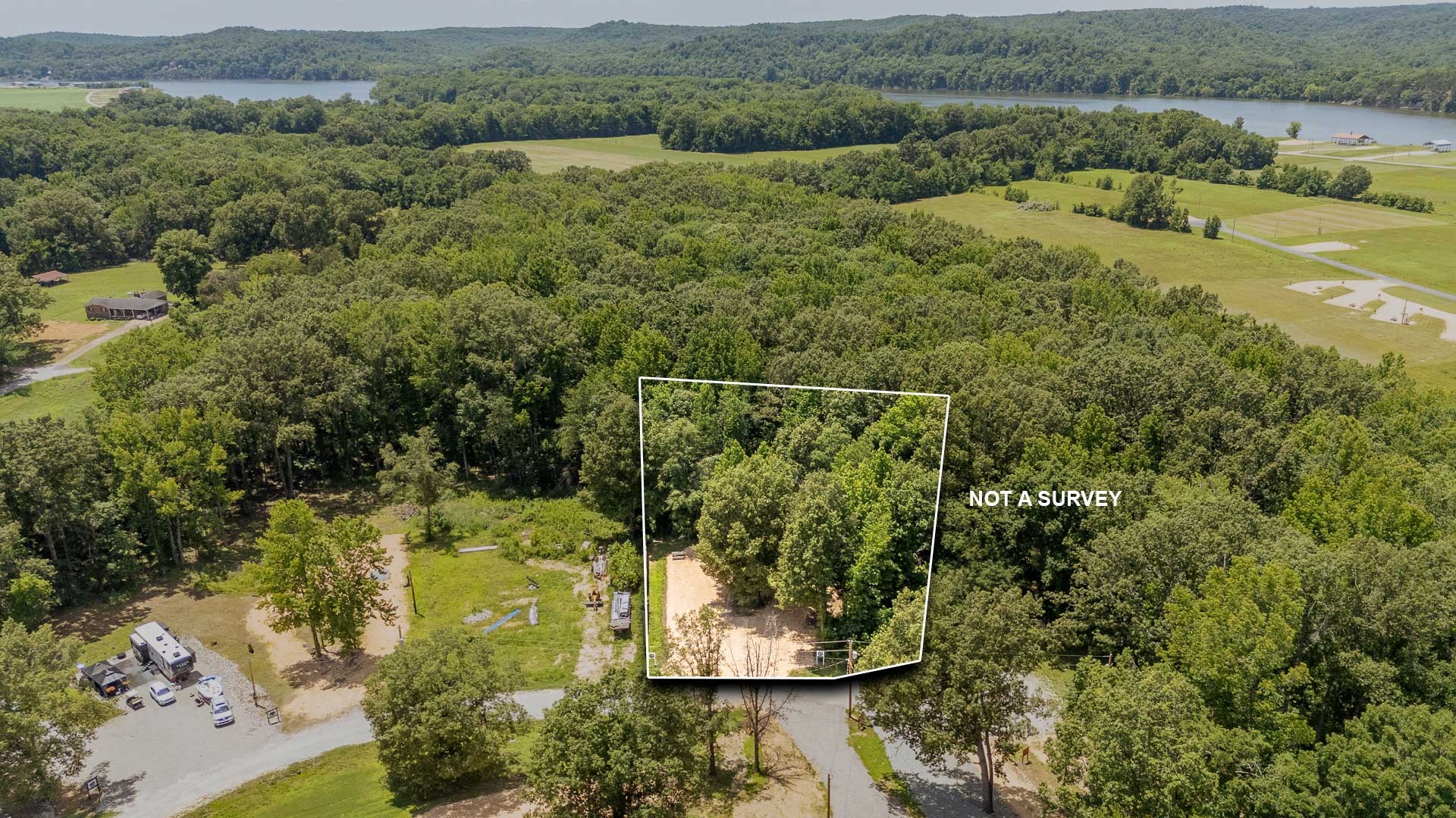 264 Duck Blind Road Clifton, TN 38425 - Photo 7 of 14 an aerial view of a residential houses with outdoor space and trees