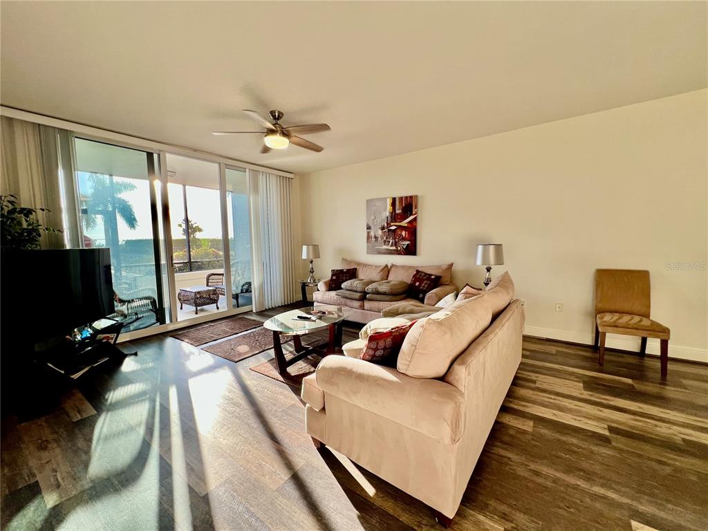 3321 Sunset Key Circle, Unit 102 Punta Gorda, FL 33955 - Photo 20 of 57 a living room with furniture fireplace and flat screen tv